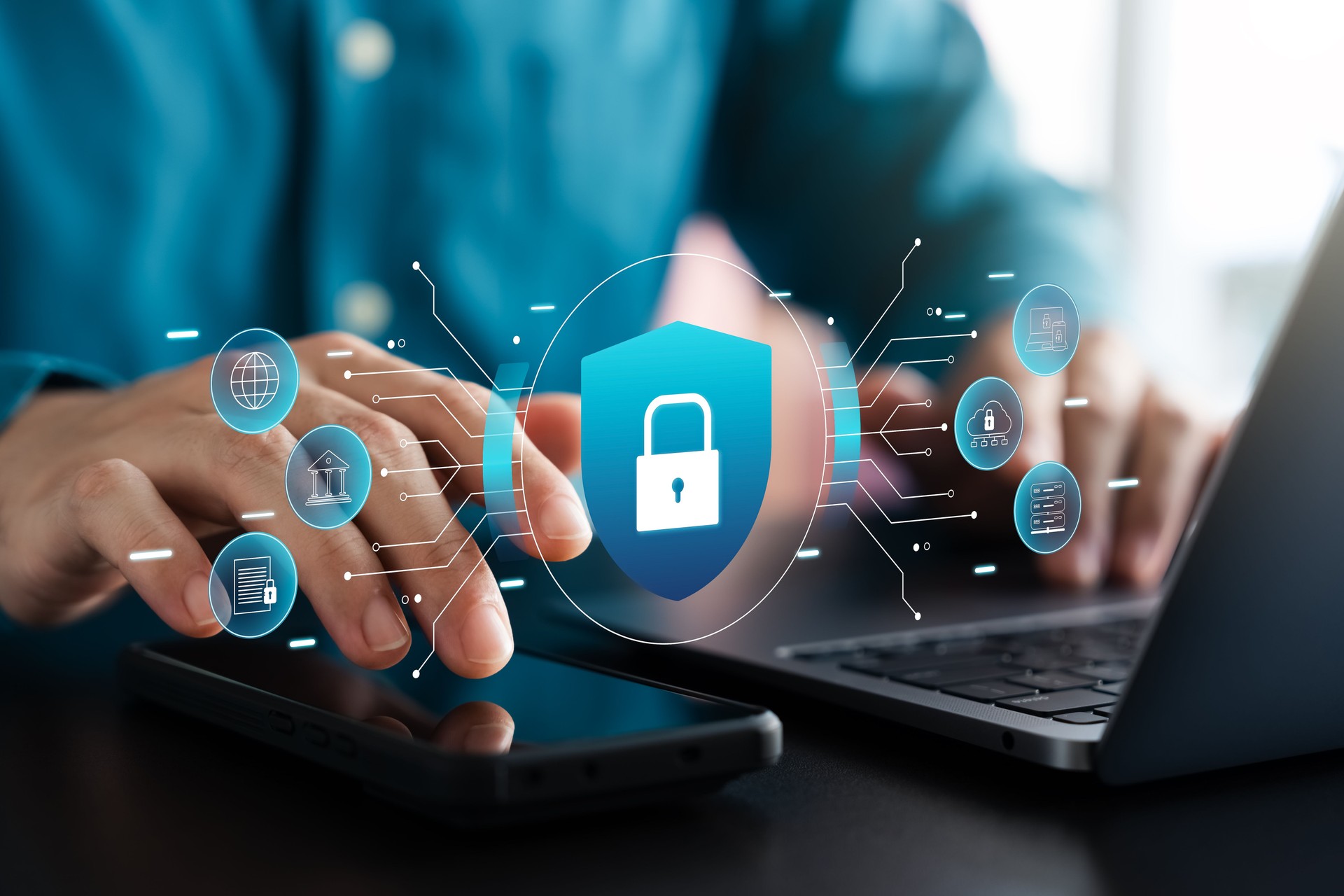 Cyber ​​security and data protection, businessman using laptop and tablet Internet network security system, protecting business financial transaction data from cyber-attacks, secure data encryption.